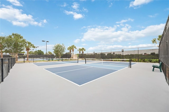 24153 Spartina Dr, Venice, FL 34293 - view of tennis court with fence and community basketball court