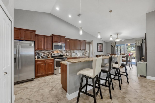 194 Sportsman Rd, Rotonda West, FL 33947 - kitchen featuring light tile patterned floors, visible vents, backsplash, and appliances with stainless steel finishes