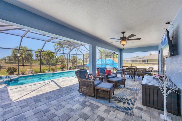 194 Sportsman Rd, Rotonda West, FL 33947 - view of patio featuring ceiling fan, a lanai, outdoor lounge area, and a pool with connected hot tub