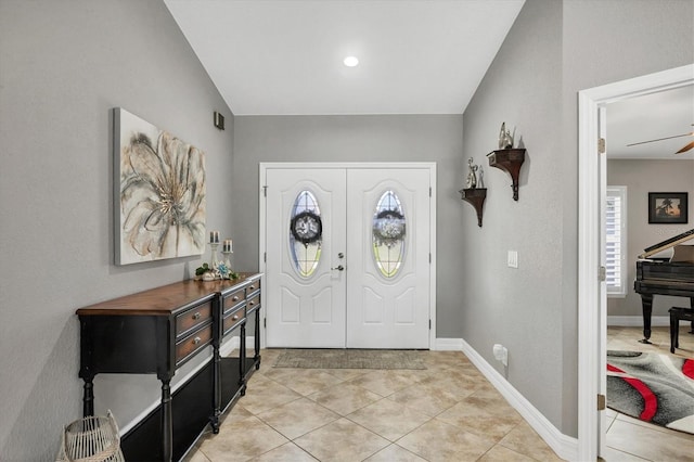 194 Sportsman Rd, Rotonda West, FL 33947 - foyer entrance with a ceiling fan, baseboards, and light tile patterned floors