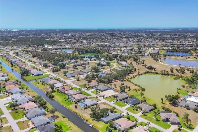 194 Sportsman Rd, Rotonda West, FL 33947 - drone / aerial view featuring a residential view and a water view