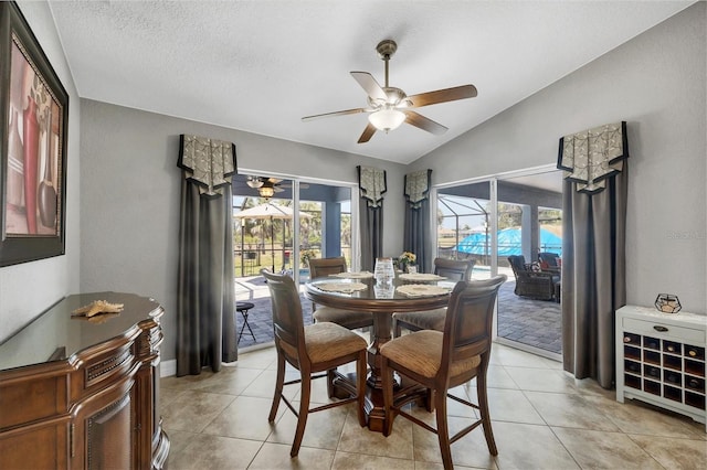194 Sportsman Rd, Rotonda West, FL 33947 - dining space featuring light tile patterned floors, lofted ceiling, a ceiling fan, and a wealth of natural light