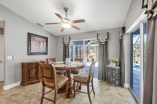 194 Sportsman Rd, Rotonda West, FL 33947 - dining area with ceiling fan, lofted ceiling, visible vents, and a wealth of natural light
