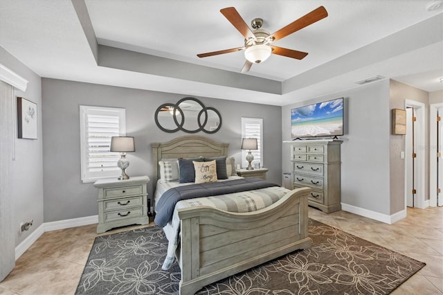 194 Sportsman Rd, Rotonda West, FL 33947 - bedroom featuring a raised ceiling, baseboards, visible vents, and light tile patterned floors