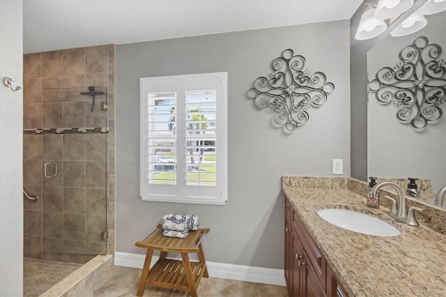 194 Sportsman Rd, Rotonda West, FL 33947 - full bathroom featuring a tile shower, baseboards, vanity, and an inviting chandelier