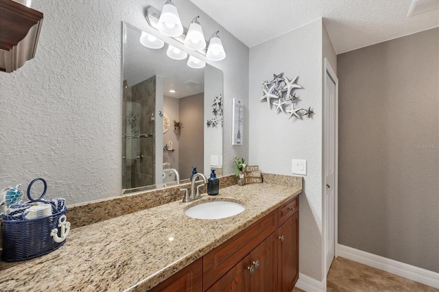 194 Sportsman Rd, Rotonda West, FL 33947 - bathroom with tile patterned floors, a stall shower, visible vents, a textured wall, and vanity