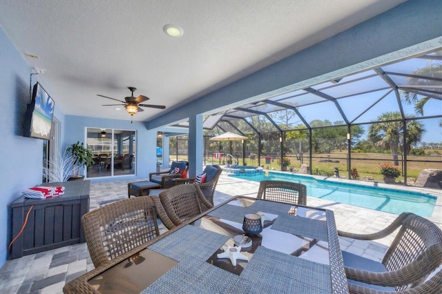 194 Sportsman Rd, Rotonda West, FL 33947 - view of patio / terrace featuring outdoor lounge area, a ceiling fan, glass enclosure, and a pool with connected hot tub