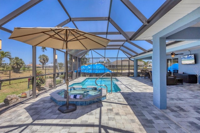 194 Sportsman Rd, Rotonda West, FL 33947 - view of swimming pool featuring a lanai, a pool with connected hot tub, a patio area, and a ceiling fan