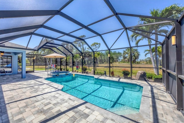 194 Sportsman Rd, Rotonda West, FL 33947 - view of swimming pool featuring glass enclosure, a pool with connected hot tub, and a patio
