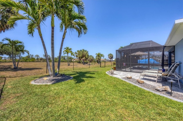 194 Sportsman Rd, Rotonda West, FL 33947 - view of yard featuring fence, an outdoor pool, a lanai, and a patio