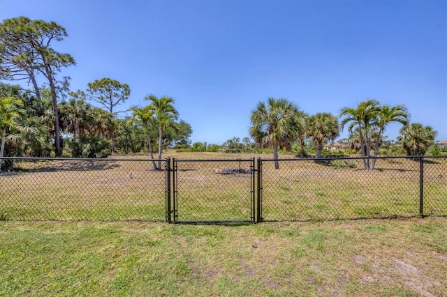 194 Sportsman Rd, Rotonda West, FL 33947 - view of yard with a gate and fence