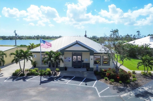 194 Sportsman Rd, Rotonda West, FL 33947 - view of building exterior featuring a water view and uncovered parking