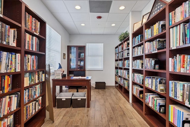 194 Sportsman Rd, Rotonda West, FL 33947 - office with a paneled ceiling, wood finished floors, baseboards, and bookshelves