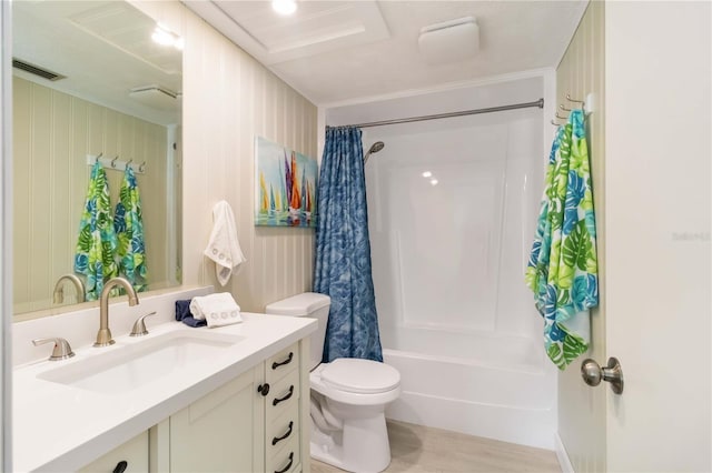 bathroom featuring shower / bath combo, visible vents, toilet, vanity, and wood finished floors