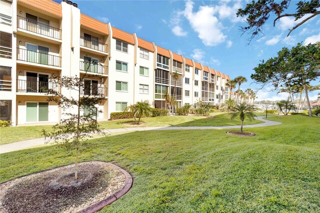 view of home's community with a lawn