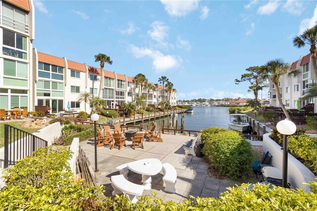exterior space featuring a water view and a residential view