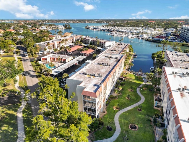 birds eye view of property with a water view