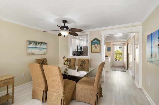 230 Santa Maria St Unit 333, Venice, FL 34285 - dining area with crown molding, light wood-style flooring, baseboards, and ceiling fan