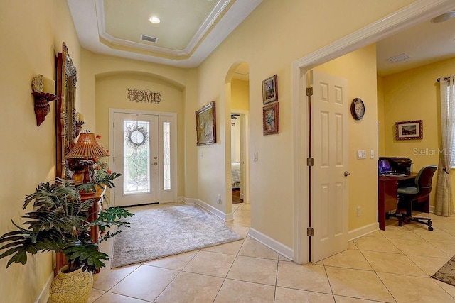 2542 Cortenova Ct, Venice, FL 34292 - foyer featuring arched walkways, light tile patterned floors, and visible vents