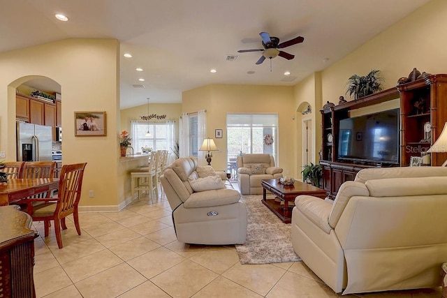 2542 Cortenova Ct, Venice, FL 34292 - living area with arched walkways, light tile patterned floors, visible vents, and a ceiling fan