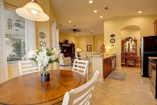 2542 Cortenova Ct, Venice, FL 34292 - dining room featuring visible vents, light tile patterned floors, arched walkways, a ceiling fan, and recessed lighting