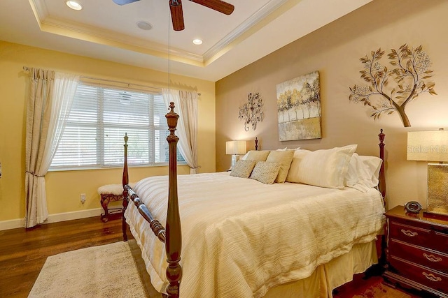 2542 Cortenova Ct, Venice, FL 34292 - bedroom with baseboards, wood finished floors, ornamental molding, and a raised ceiling