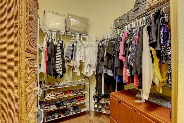 2542 Cortenova Ct, Venice, FL 34292 - spacious closet featuring wood finished floors
