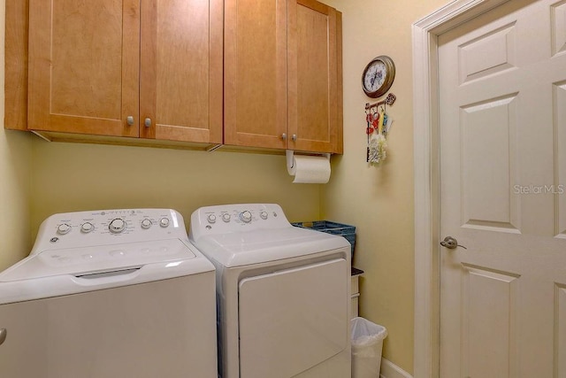 2542 Cortenova Ct, Venice, FL 34292 - clothes washing area featuring cabinet space and washer and clothes dryer