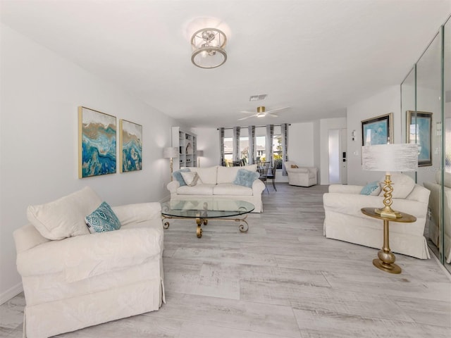 1232 Pine Needle Rd, Venice, FL 34285 - living room featuring a ceiling fan and visible vents