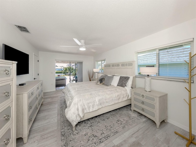 1232 Pine Needle Rd, Venice, FL 34285 - bedroom with light wood-style flooring, visible vents, access to exterior, and a ceiling fan