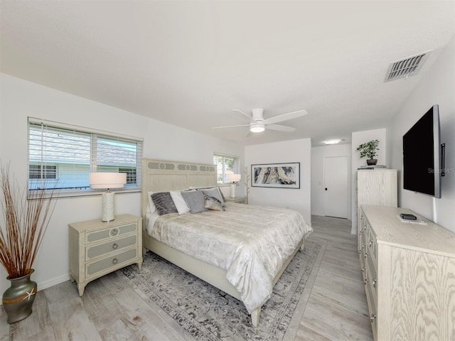 1232 Pine Needle Rd, Venice, FL 34285 - bedroom with light wood-style flooring, multiple windows, and visible vents