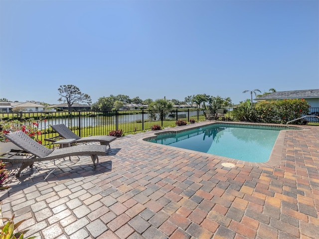 1232 Pine Needle Rd, Venice, FL 34285 - view of swimming pool with a water view, a patio area, a fenced backyard, and a fenced in pool