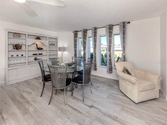 1232 Pine Needle Rd, Venice, FL 34285 - dining space with light wood-style flooring and baseboards