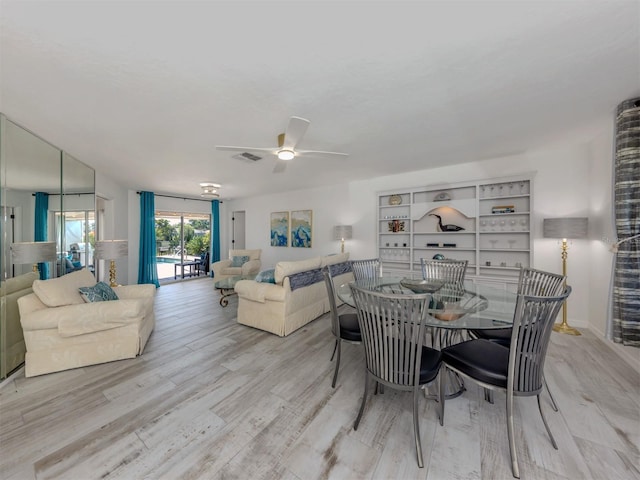 1232 Pine Needle Rd, Venice, FL 34285 - dining area with visible vents, ceiling fan, and wood finished floors