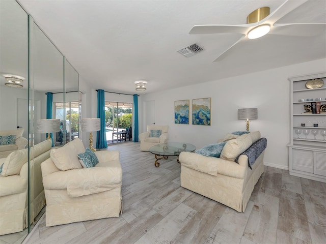 1232 Pine Needle Rd, Venice, FL 34285 - living area with visible vents, ceiling fan, and wood finished floors