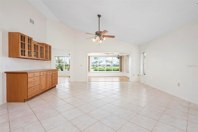 799 Harrington Lake Dr N Unit 73, Venice, FL 34293 - unfurnished living room featuring light tile patterned floors, visible vents, baseboards, and ceiling fan