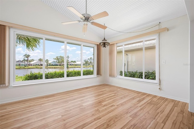 799 Harrington Lake Dr N Unit 73, Venice, FL 34293 - unfurnished room featuring a water view, light wood-type flooring, vaulted ceiling, and a ceiling fan