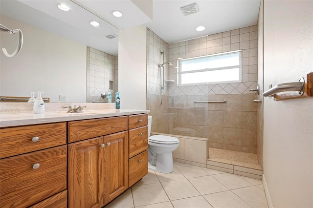 799 Harrington Lake Dr N Unit 73, Venice, FL 34293 - full bath featuring tiled shower, vanity, visible vents, toilet, and tile patterned floors