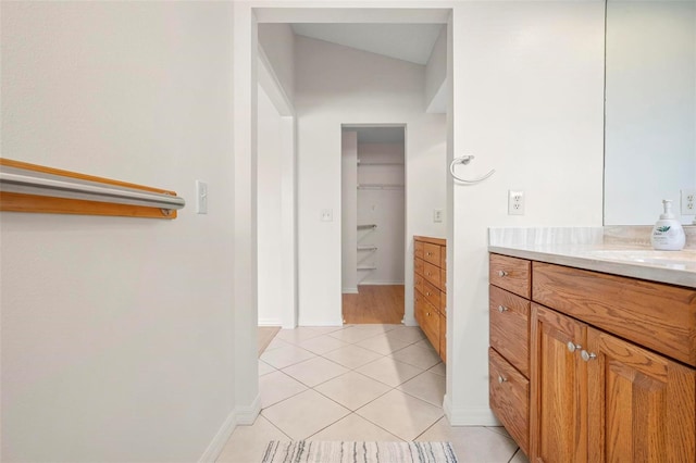799 Harrington Lake Dr N Unit 73, Venice, FL 34293 - bathroom with vanity, baseboards, and tile patterned flooring