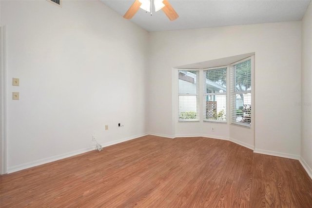 799 Harrington Lake Dr N Unit 73, Venice, FL 34293 - spare room with light wood-style flooring, a ceiling fan, baseboards, and lofted ceiling