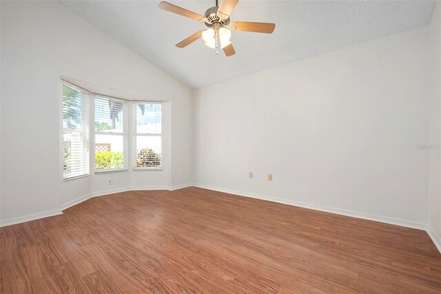 799 Harrington Lake Dr N Unit 73, Venice, FL 34293 - unfurnished room with light wood-style flooring, baseboards, vaulted ceiling, and a ceiling fan