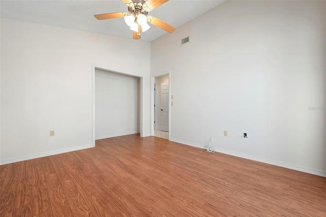 799 Harrington Lake Dr N Unit 73, Venice, FL 34293 - unfurnished room with visible vents, baseboards, a ceiling fan, light wood-style flooring, and high vaulted ceiling