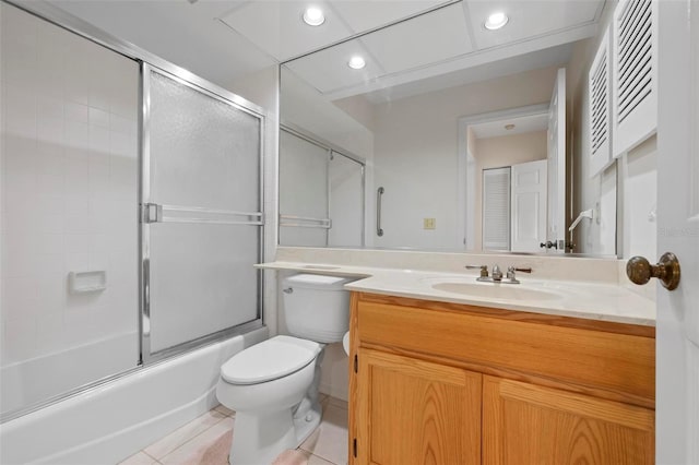 799 Harrington Lake Dr N Unit 73, Venice, FL 34293 - full bathroom featuring combined bath / shower with glass door, toilet, recessed lighting, vanity, and tile patterned floors
