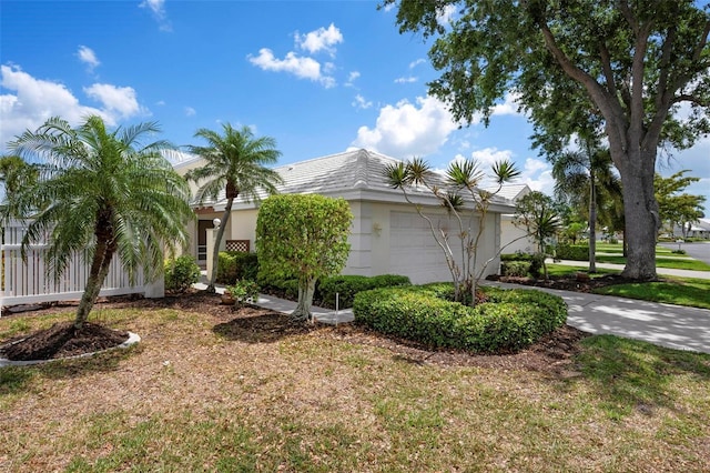 799 Harrington Lake Dr N Unit 73, Venice, FL 34293 - view of side of home featuring stucco siding and an attached garage