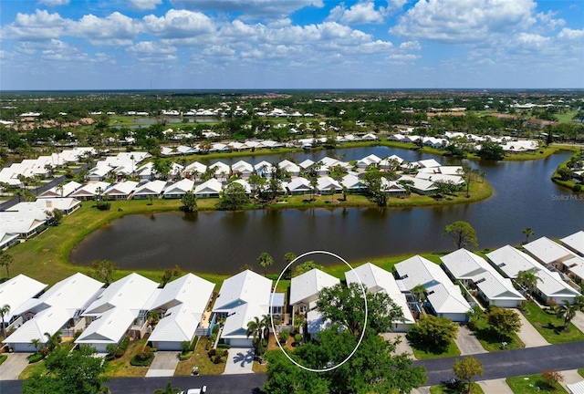 799 Harrington Lake Dr N Unit 73, Venice, FL 34293 - drone / aerial view featuring a water view and a residential view
