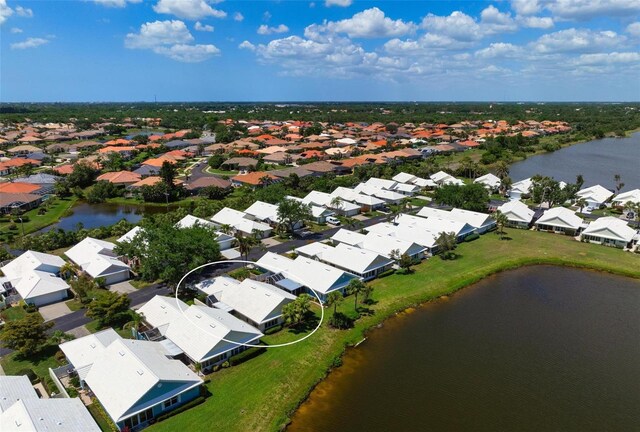 799 Harrington Lake Dr N Unit 73, Venice, FL 34293 - drone / aerial view with a water view and a residential view