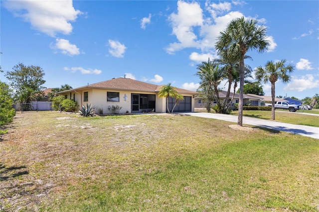 single story home featuring stucco siding, driveway, a front lawn, a garage, and fence