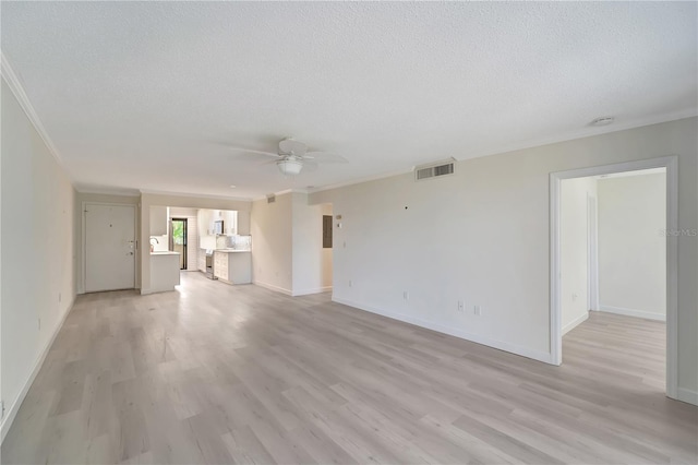 700 Golden Beach Blvd Unit 115, Venice, FL 34285 - unfurnished living room featuring crown molding, a textured ceiling, a ceiling fan, light wood-type flooring, and baseboards