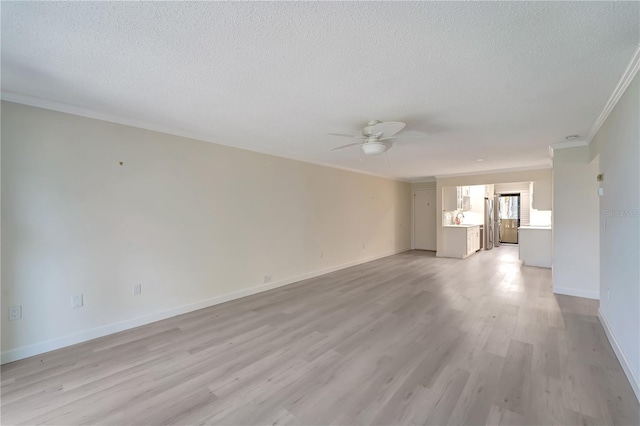 700 Golden Beach Blvd Unit 115, Venice, FL 34285 - unfurnished living room with crown molding, a ceiling fan, light wood-type flooring, a textured ceiling, and baseboards