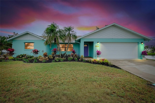 990 Sea Fox Rd, Venice, FL 34293 - ranch-style house with a garage, driveway, stucco siding, and a front lawn
